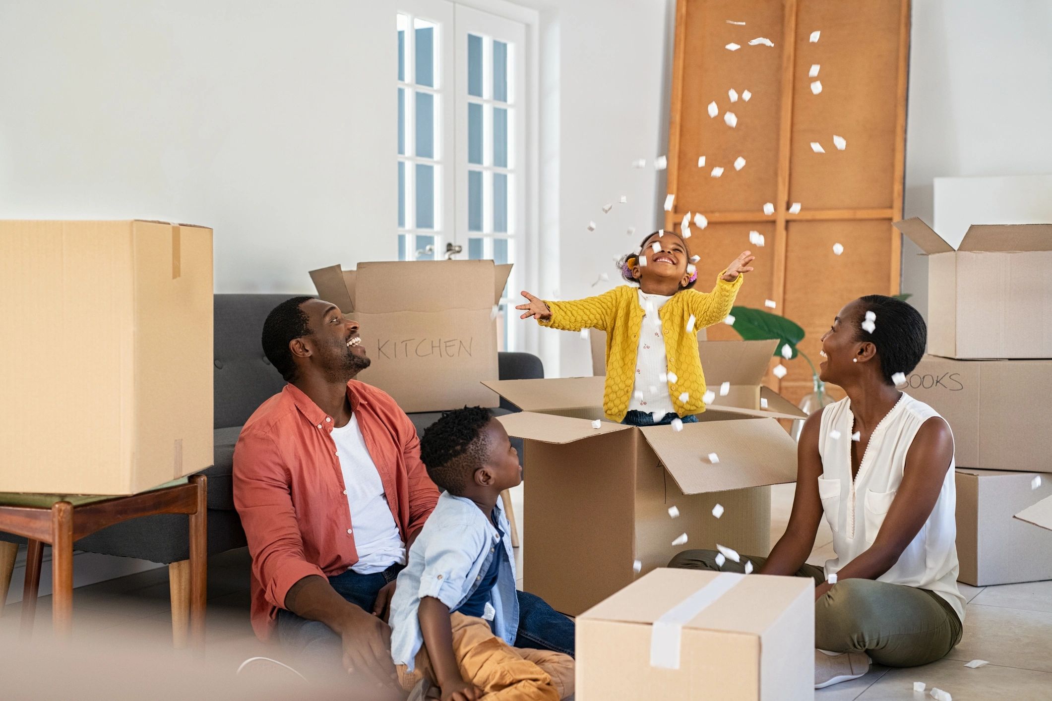 Satisfied family in their new home after moving day