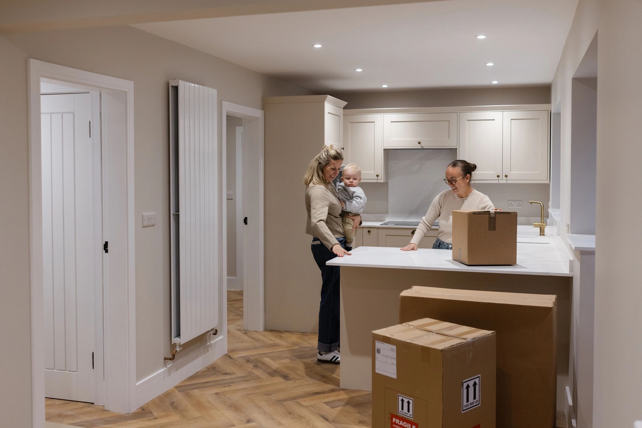 Family arriving and unpacking in a new home